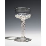 A mead glass c.1760, the shallow cup bowl with gadroon moulding, raised on a double series opaque