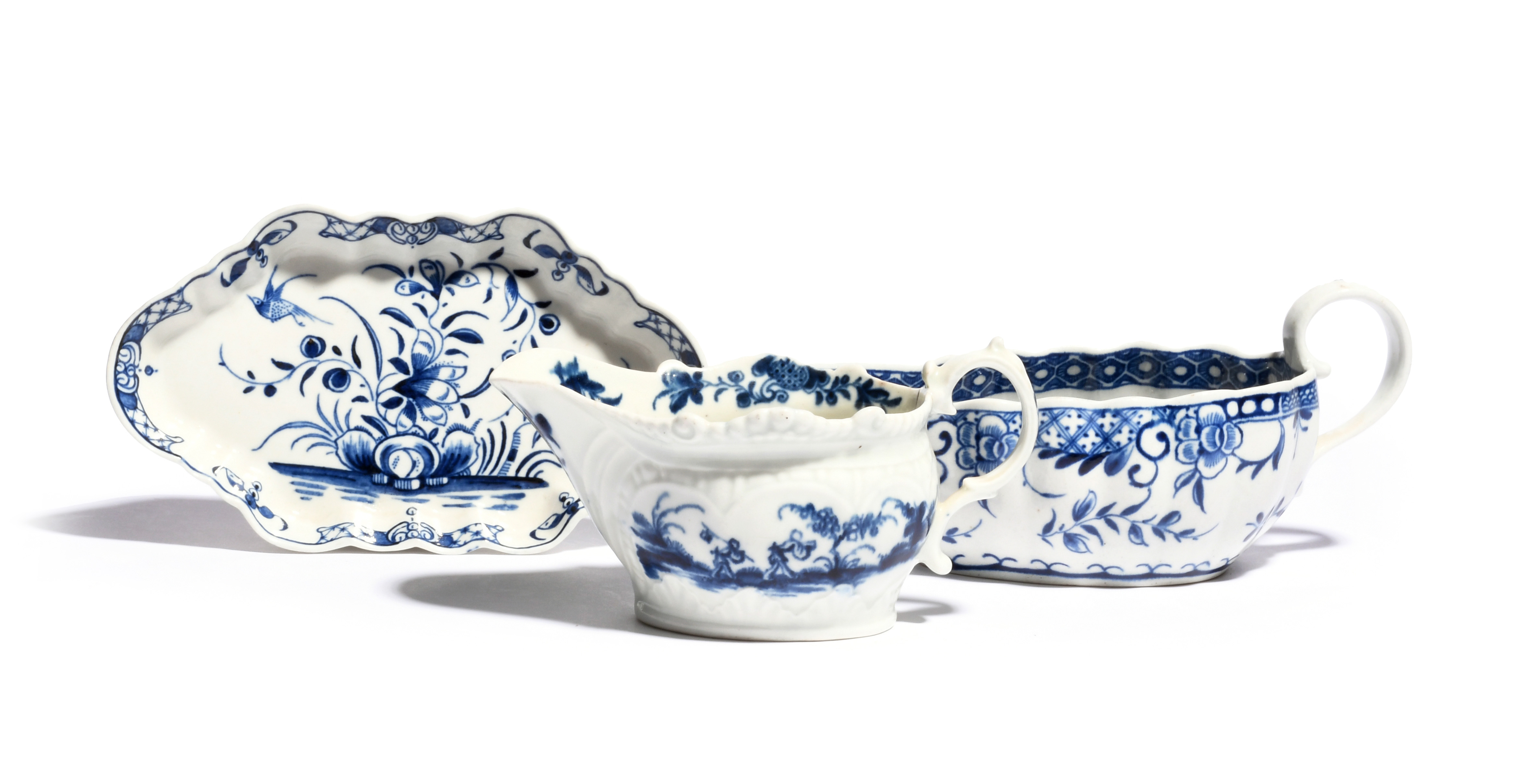 Two Worcester blue and white sauceboats c.1770, one painted with the Two Porter Landscape pattern,