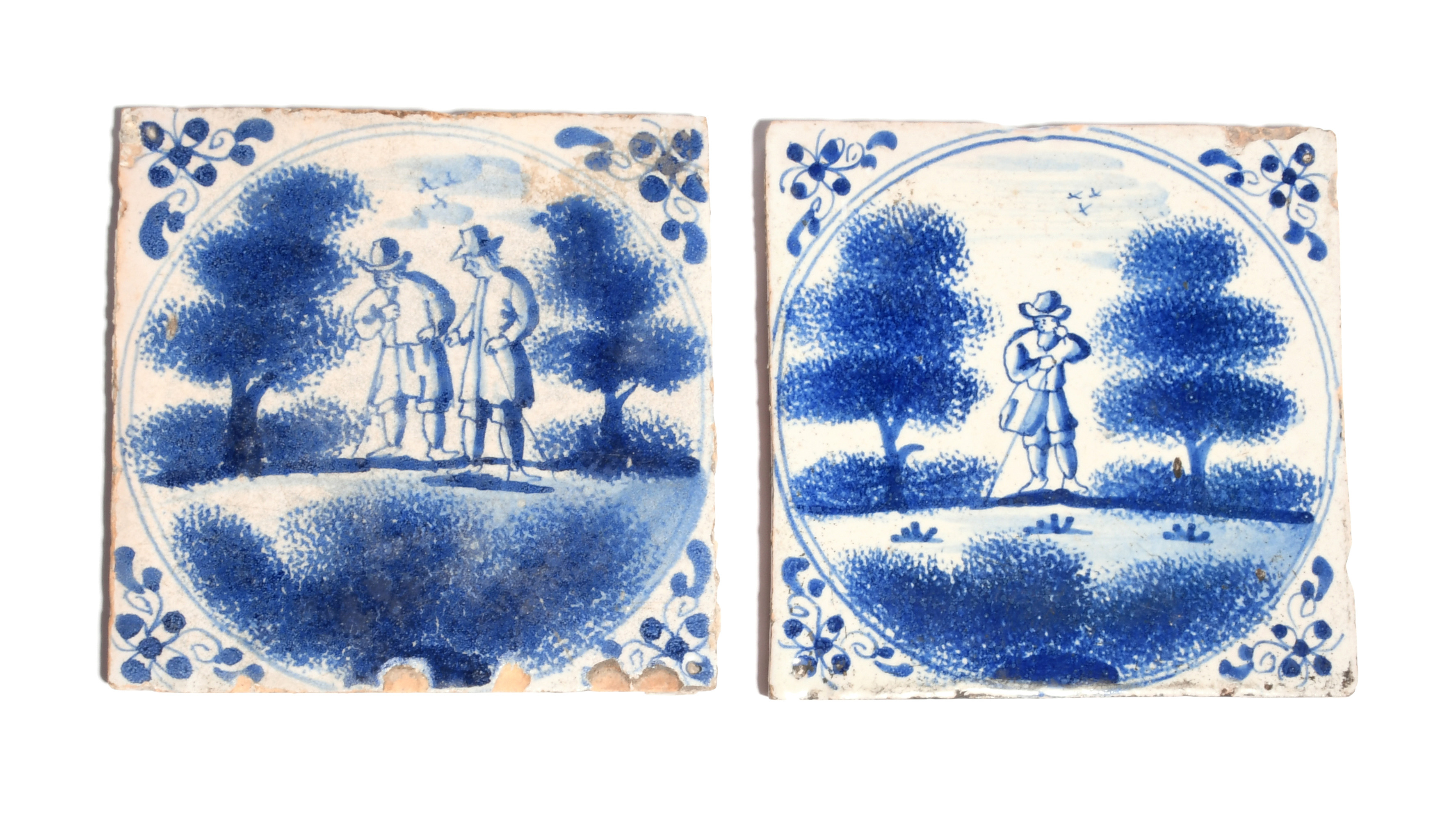 Two delftware tiles c.1700, probably London, painted in blue with figures standing between sponged