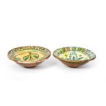 Two Continental slipware bowls or deep dishes probably 19th century, painted in green, blue and