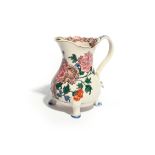 A Staffordshire salt-glazed footed cream jug c.1760, brightly enamelled in the manner of Chinese