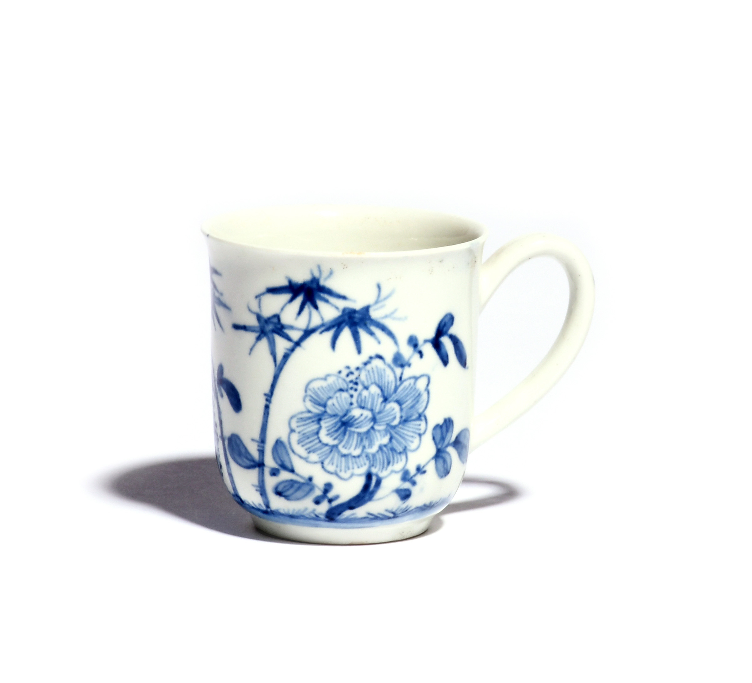 A rare Worcester Scratch Cross blue and white coffee cup c.1754, the rounded form with everted