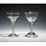 Two sweetmeat glasses c.1760, both with ogee bowls raised on opaque twist stems above domed and