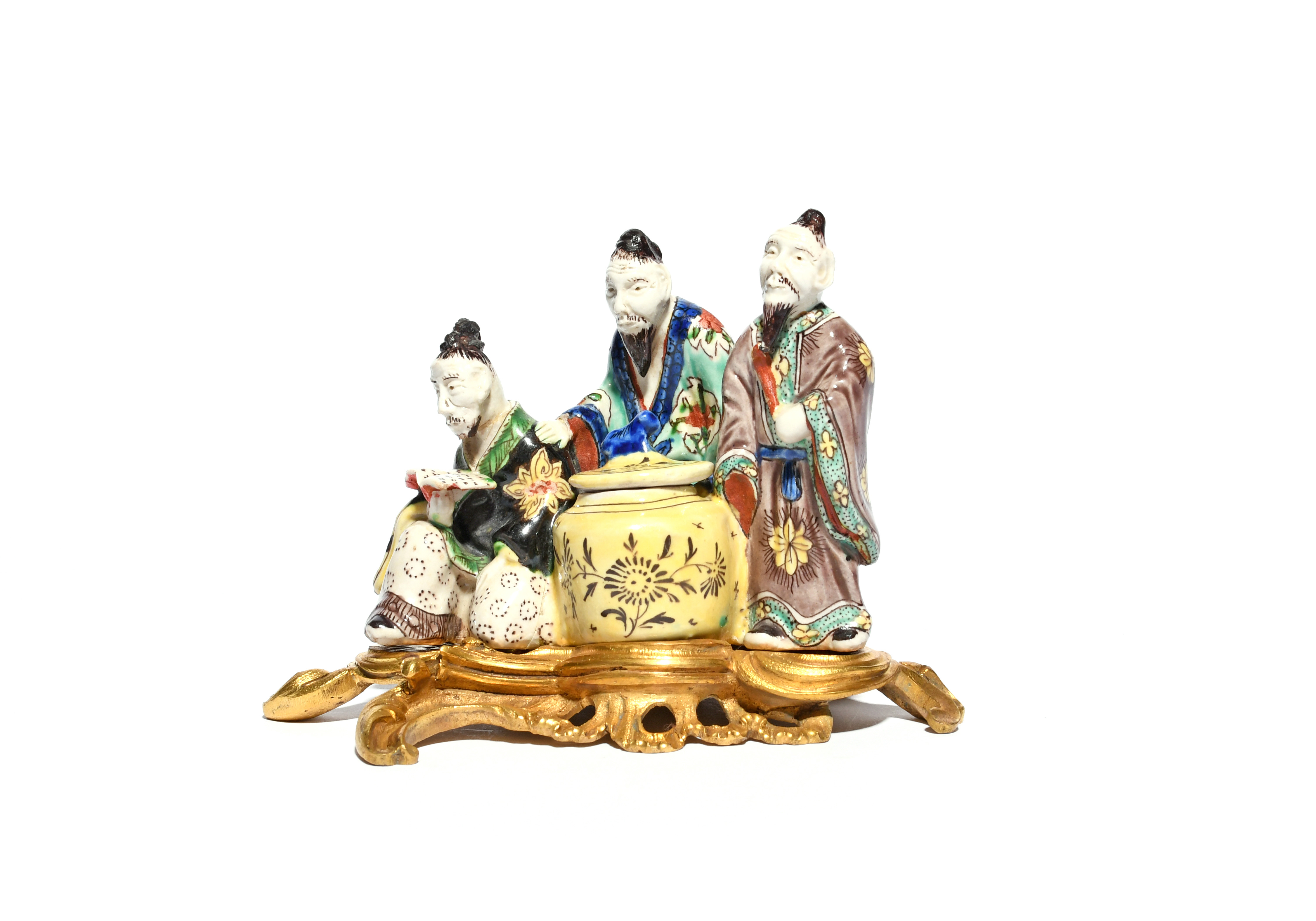 An unusual Continental porcelain chinoiserie figure group probably 19th century, modelled as three