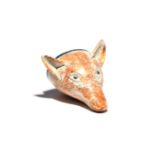 A large pearlware stirrup cup c.1800, modelled as the head of a fox, with ears pricked, sponged in