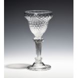 A sweetmeat glass c.1750, the ogee bowl with fine honeycomb moulding, raised on a pedestal stem