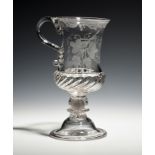 A tall coin tankard c.1790, engraved with hops and barley around the initials JJ, the hollow stem