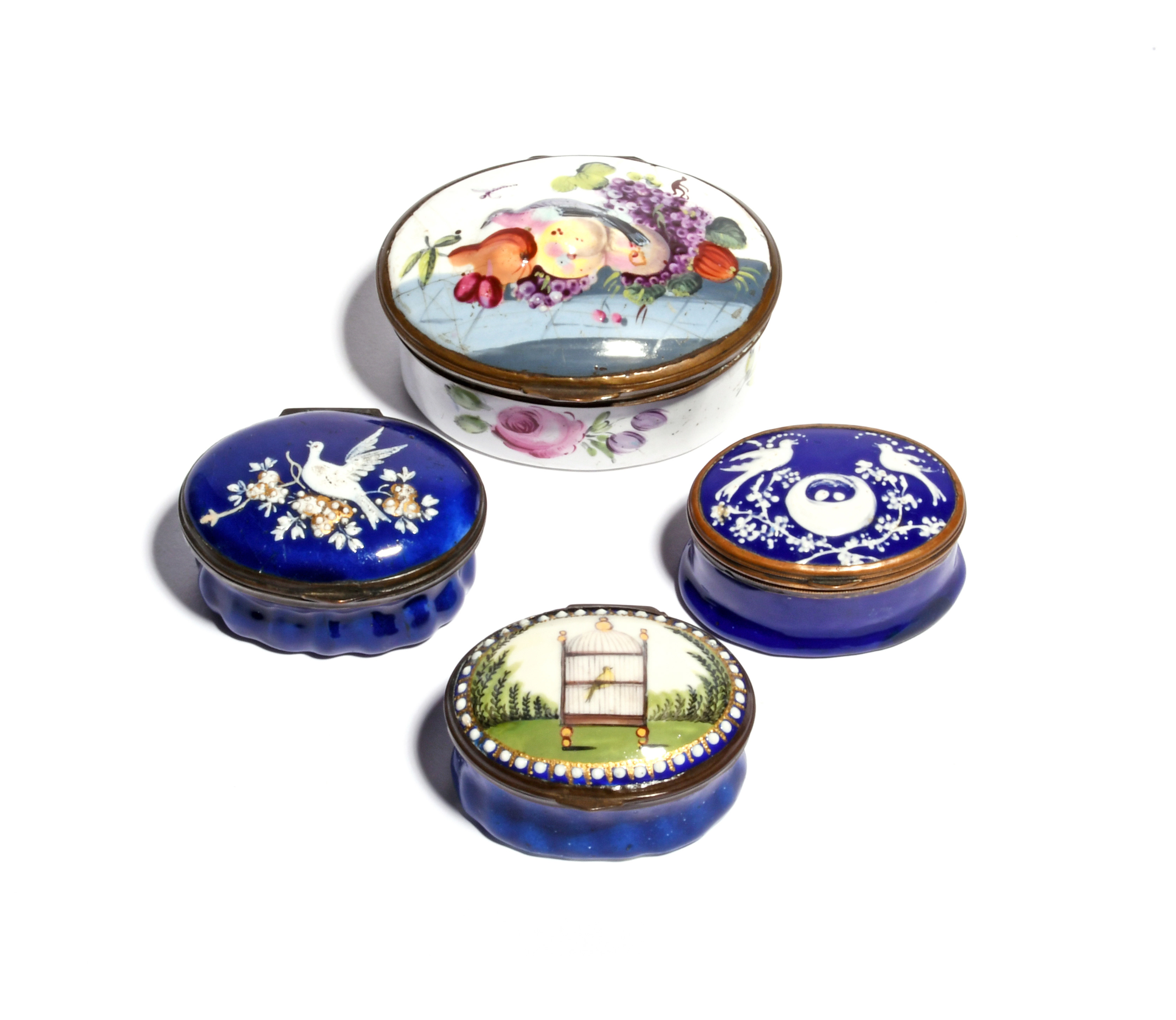 Three enamel patch boxes and a snuff box c.1760-80, the oval forms variously decorated with birds on