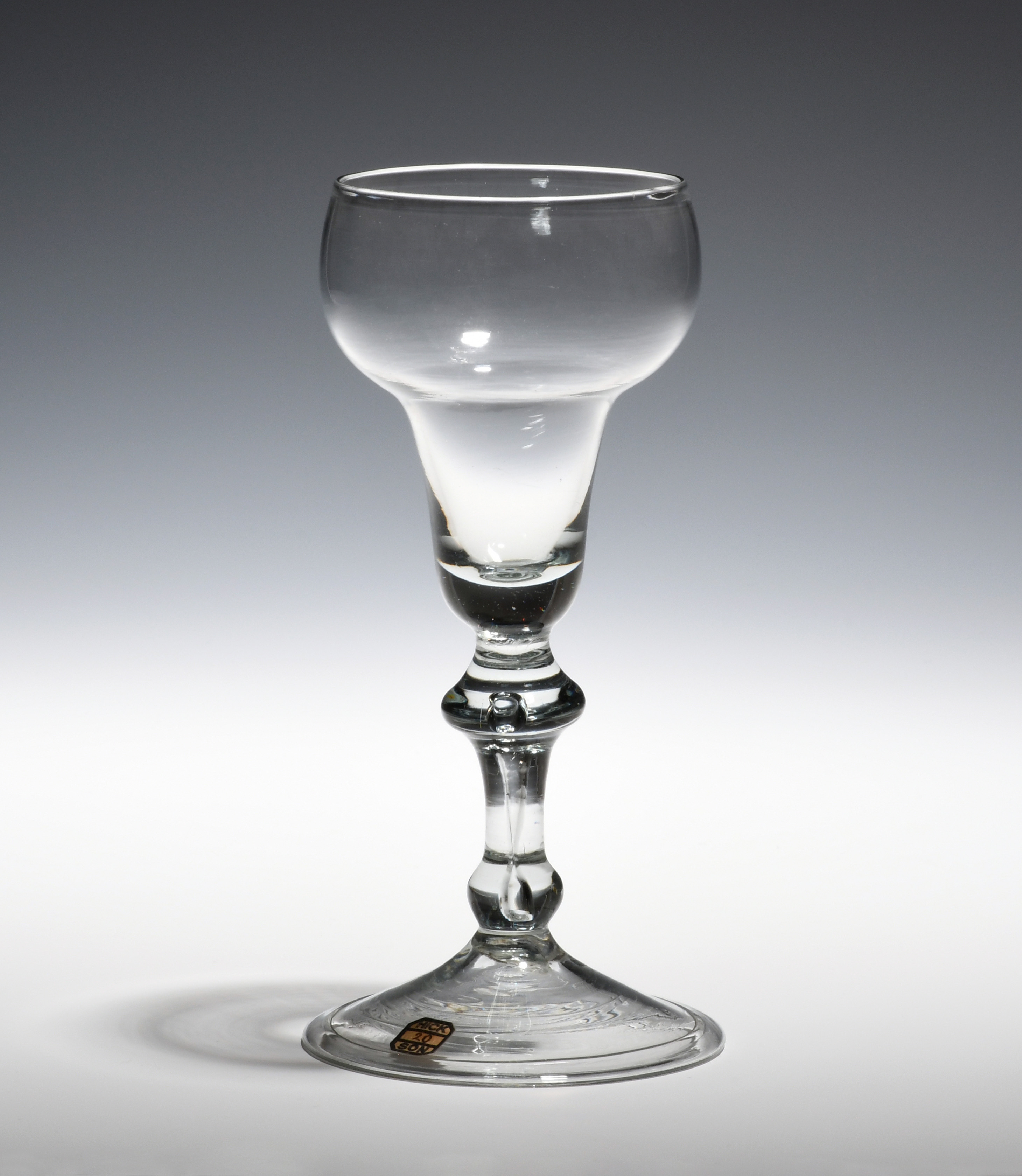 A balustroid wine glass c.1730, with double ogee bowl raised on a stem with angular and basal