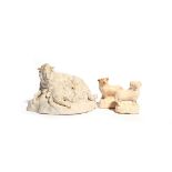 A salt-glazed stoneware figure group of a sheep and its lamb c.1770, recumbent on a grassy base, and