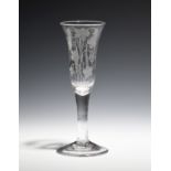 An ale glass c.1770, the drawn bell bowl engraved with a growing hop bine raised on a plain stem