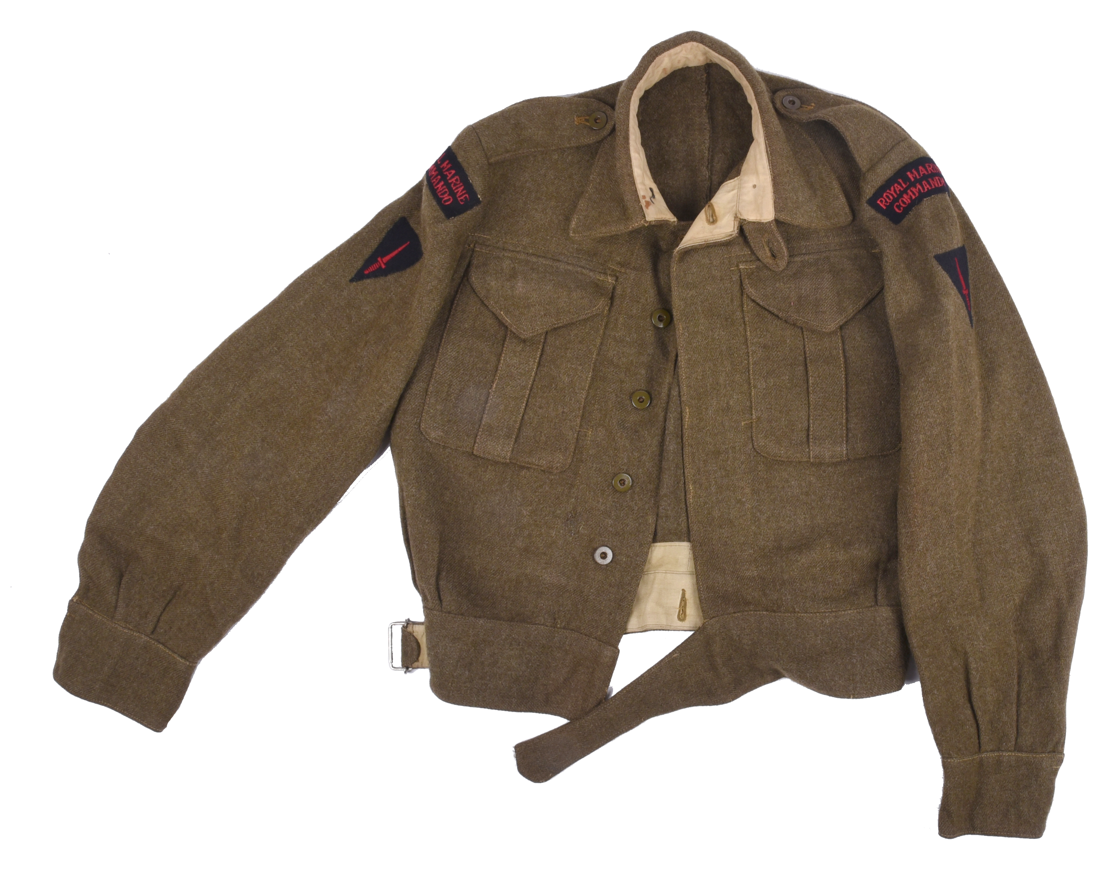 A Royal Marine Commando battle dress blouse, with fabric shoulder titles and dagger badges.