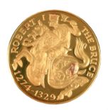 The National Trust for Scotland: Battle of Bannockburn 700th Anniversary, a 22 carat gold medal,