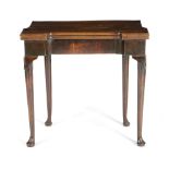 A GEORGE II MAHOGANY TEA TABLE C.1740 the hinged fold-over top with protruding corners, on a