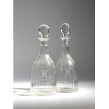 A NEAR PAIR OF CUT-GLASS DECANTERS AND STOPPERS IN GEORGIAN STYLE PROBABLY LATE 19TH / EARLY 20TH