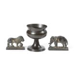 A PAIR OF PATINATED BRASS CHIMNEY ORNAMENTS 19TH CENTURY in the form of a flat back lion and an