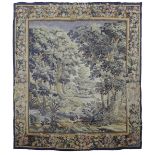 A VERDURE TAPESTRY OF A LANDSCAPE FLEMISH, 19TH CENTURY woven with coloured wools, within a