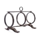 A WROUGHT IRON PIPE KILN 17TH / 18TH CENTURY with three rings, on scroll feet, the top with a