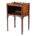 A MAHOGANY TRAY-TOP BEDSIDE CUPBOARD IN CHINESE CHIPPENDALE STYLE the shaped gallery pierced with