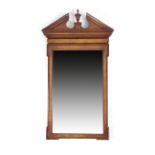 A WALNUT MIRROR IN GEORGE II STYLE 20TH CENTURY the rectangular plate within a Kentian frame, the