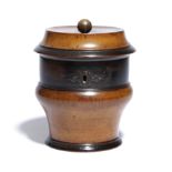 A GERMAN FRUITWOOD TEA CADDY EARLY 19TH CENTURY with a brass ball finial, the turned body with