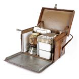 A BROWN LEATHER CASED 'EN ROUTE' PICNIC SET BY DREW & SONS, PICCADILLY LONDON with a hinged lid