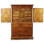 A WILLIAM AND MARY WALNUT CABINET ON CHEST LATE 17TH / EARLY 18TH CENTURY AND LATER with a cushion