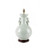 A CHINESE PORCELAIN CELADON GLAZED VASE TABLE LAMP PROBABLY LATE 19TH CENTURY with moulded