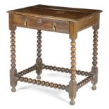 A WILLIAM AND MARY OAK SIDE TABLE C.1690 the boarded top with a moulded edge, above a frieze drawer,