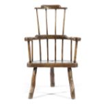 A PRIMITIVE ELM AND ASH WINDSOR STYLE ARMCHAIR POSSIBLY WELSH, LATE 18TH / EARLY 19TH CENTURY the