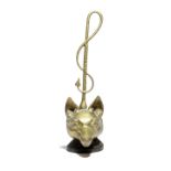 A BRASS FOX'S HEAD DOORSTOP BY PEERAGE, EARLY 20TH CENTURY the handle in the form of a riding