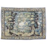 A FLEMISH VERDURE TAPESTRY; LATE 17TH / EARLY 18TH CENTURY; worked with a chateau before a lake with