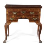 A GEORGE II FRUITWOOD LOWBOY; C.1740-50; possibly cherrywood, the crossbanded top above three elm