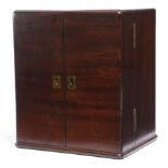 A MAHOGANY APOTHECARY'S CABINET EARLY 19TH CENTURY the top with a military style brass sunken