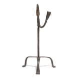 A WROUGHT IRON TABLE RUSHNIP AND CANDLE HOLDER 18TH CENTURY on a tripod base 33.4cm high