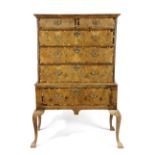 A GEORGE I WALNUT CHEST ON STAND EARLY 18TH CENTURY with two short and three long laburnum banded