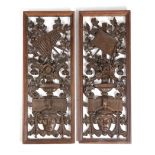 A PAIR OF FRENCH CARVED OAK PANELS OF URNS OF FLOWERS 19TH CENTURY decorated with musical