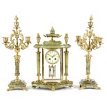 A FRENCH ONYX AND ORMOLU CLOCK GARNITURE LATE 19TH / EARLY 20TH CENTURY the brass eight day drum