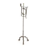 A GEORGE III STEEL FLOOR STANDING ADJUSTABLE CANDLEHOLDER 18TH CENTURY with a brass ball finial,