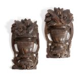 A PAIR OF FLEMISH CARVED OAK FRAGMENTS LATE 17TH CENTURY of urns issuing leaves, fruit and