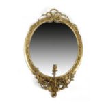 A VICTORIAN GILT COMPOSITION GIRANDOLE BY C. NOSOTTI, C.1860-70 the oval plate within a leaf and