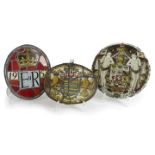 THREE STAINED GLASS PANELS comprising: an oval leaded example bearing the arms of the city of