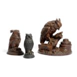 A BLACK FOREST CARVED LINDEN WOOD OWL INKSTAND LATE 19TH CENTURY the bird perched on a tree stump