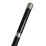 'WATERLOO INTEREST' AN EBONISED WALKING CANE 19TH CENTURY with a silver cap handle and a silver