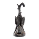 A VICTORIAN CAST IRON HARE DOORSTOP SECOND HALF 19TH CENTURY black painted, with a leaf handle and a
