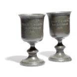 TWO PEWTER COMMUNION GOBLETS 19TH CENTURY of bell shape, with a turned stem and domed foot, each