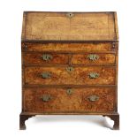 A GEORGE I WALNUT AND BURR ELM BUREAU EARLY 18TH CENTURY cross and feather banded with burr elm