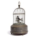 A FRENCH BRASS AUTOMATON SINGING BIRD IN CAGE LATE 19TH / EARLY 20TH CENTURY with a clockwork