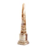 AN ITALIAN GRAND TOUR MODEL OF AN OBELISK 19TH CENTURY of mottled amber and white alabaster, with