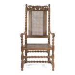 A CHARLES II WALNUT OPEN ARMCHAIR LATE 17TH CENTURY with a caned back and seat, the top rail